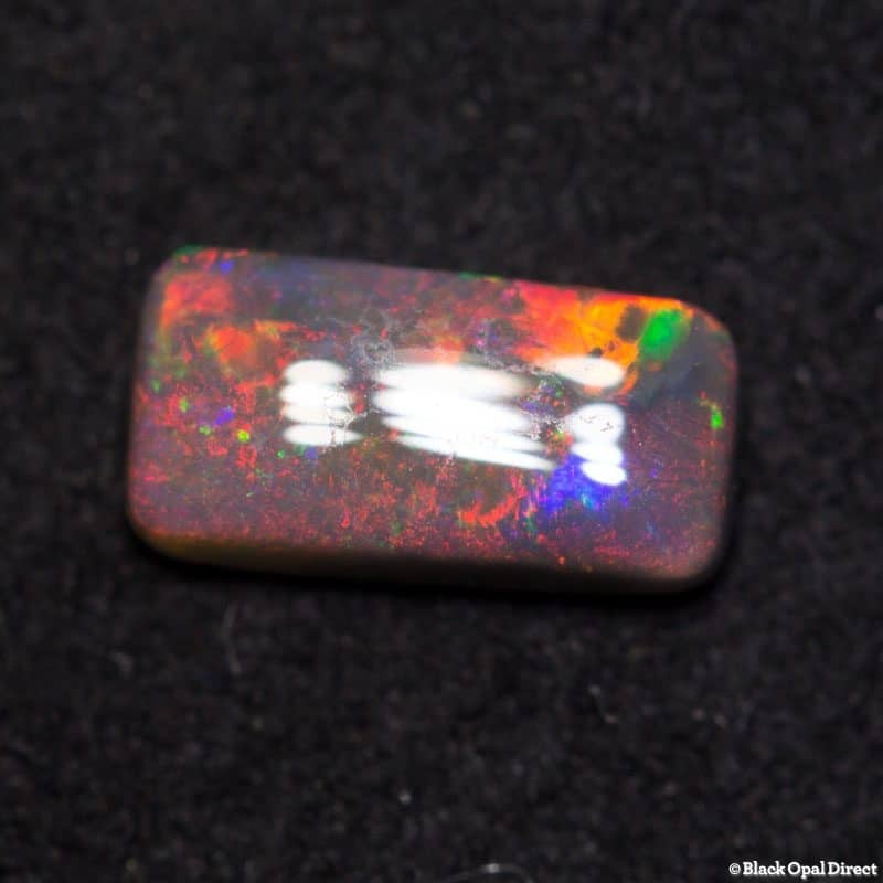 0.43 cushion cut dark opal 7x3.5x2mm - Image 2