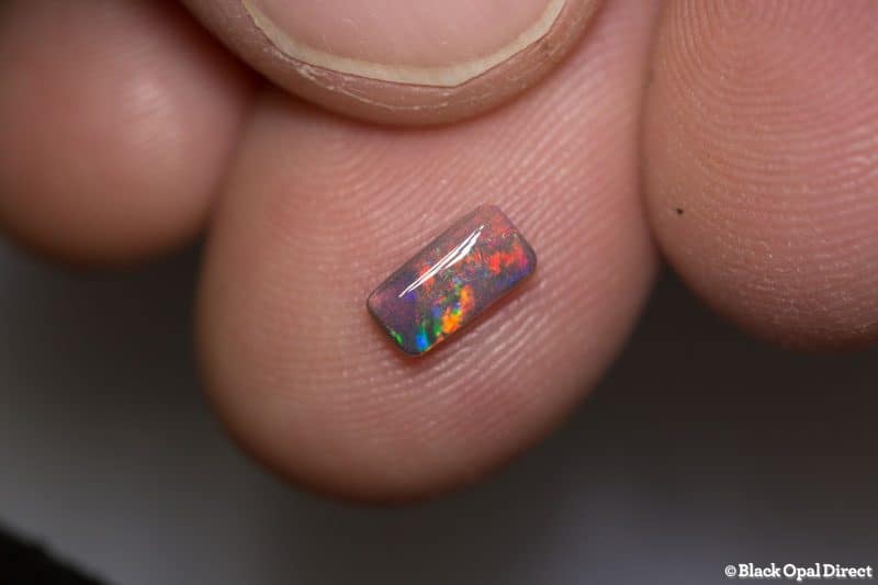 0.43 cushion cut dark opal 7x3.5x2mm - Image 3
