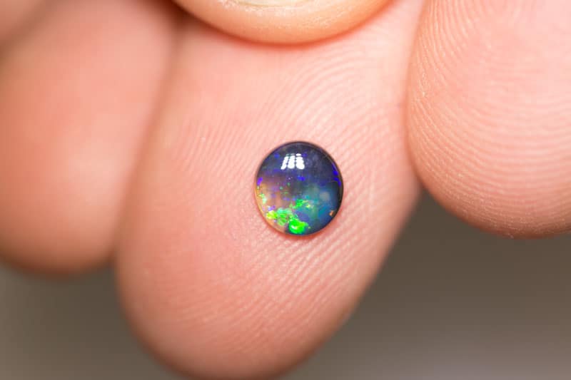 0.48 ct black opal 6mm round x2mm - Image 2