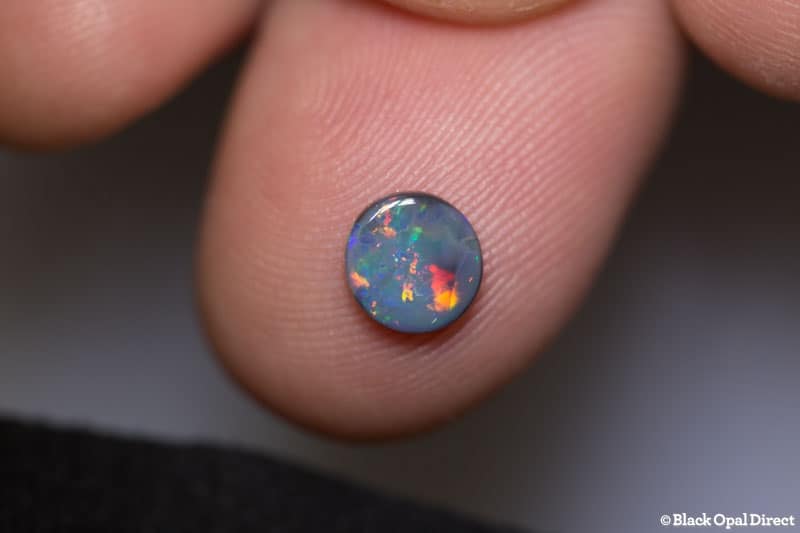 0.52 ct black opal 6mm round x 1.5mm - Image 3