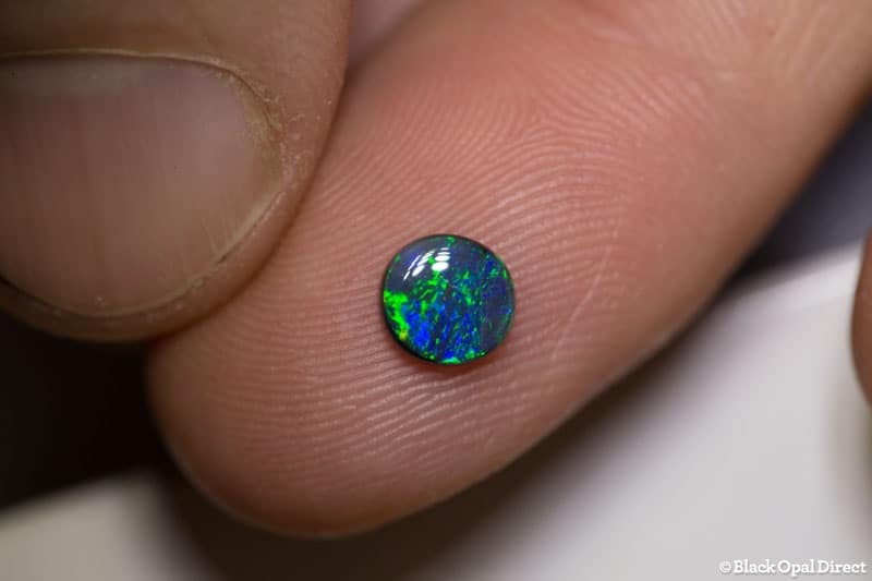 0.52 ct black opal 6mm round x2mm - Image 2