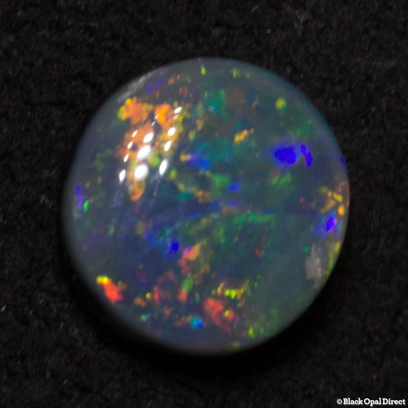 0.52 ct black opal 6mm round x2mm - Image 4