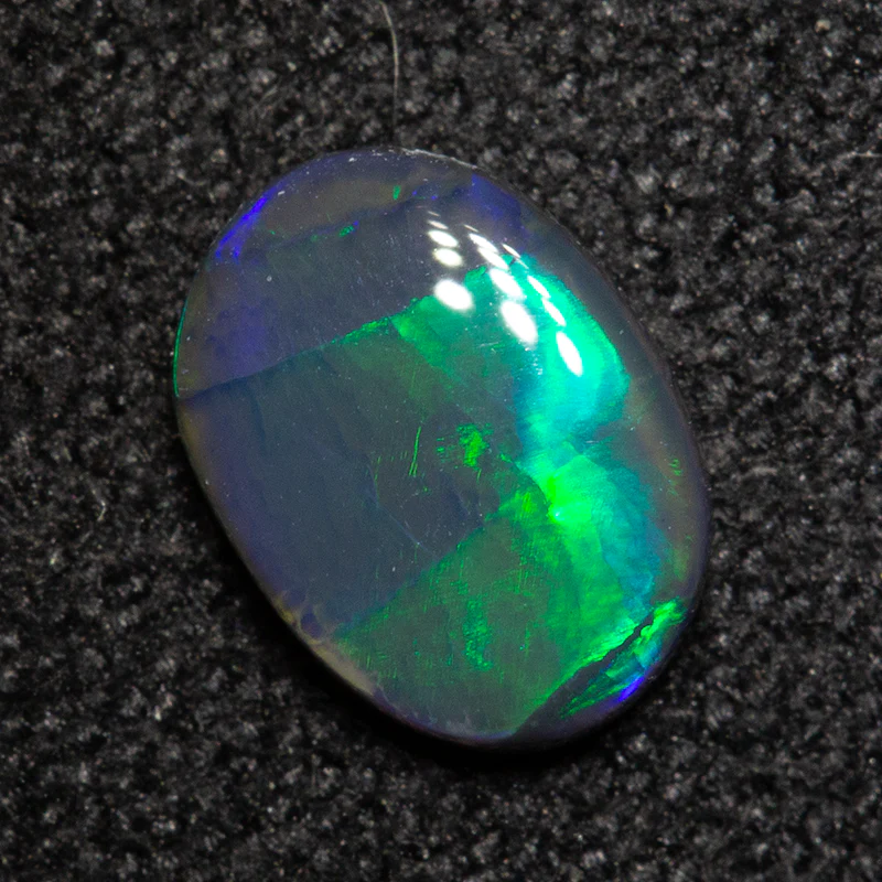 0.53 ct black opal 7.2x5.3x2mm - Image 2