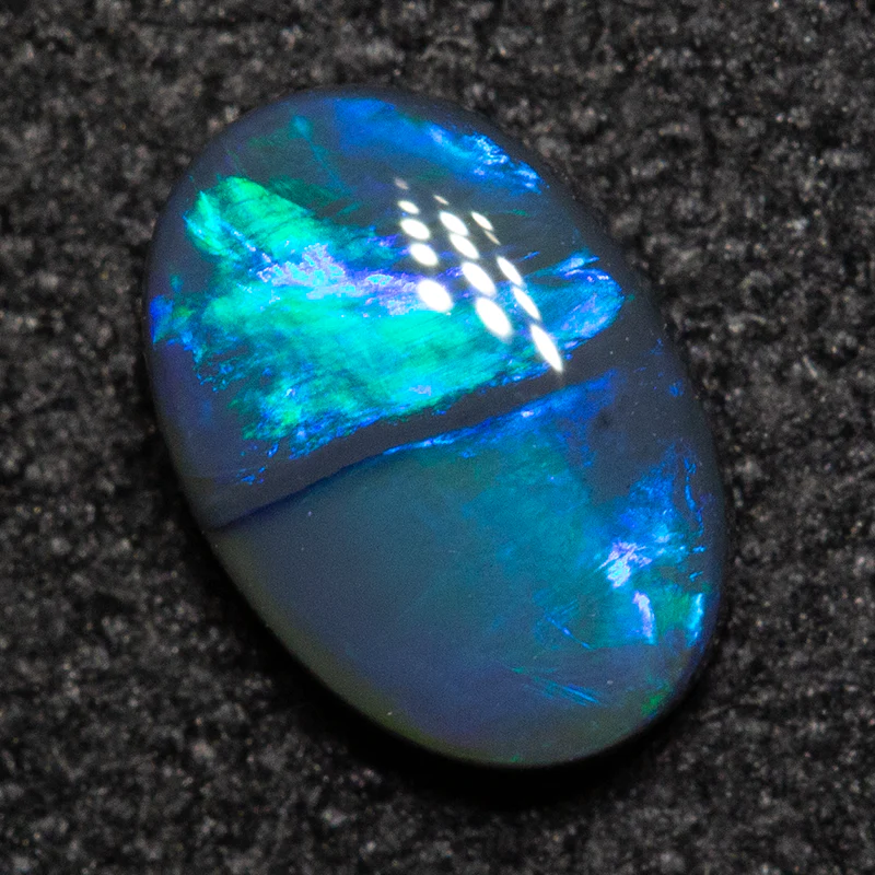 0.54 ct black opal 6.8x4.8x2.4mm - Image 2