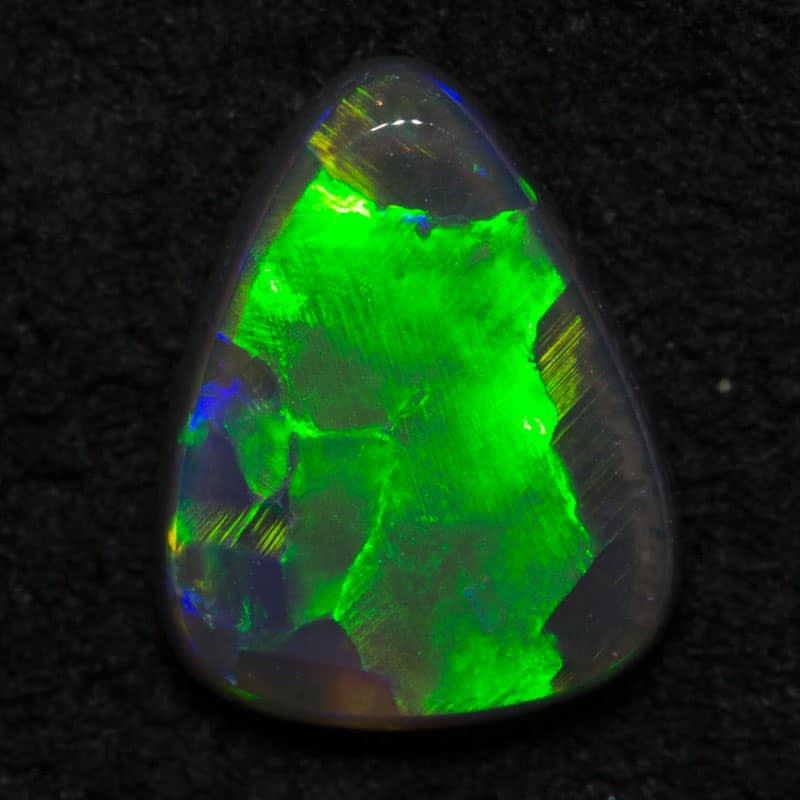 0.54 ct black opal drop gem 7x5x2mm - Image 2