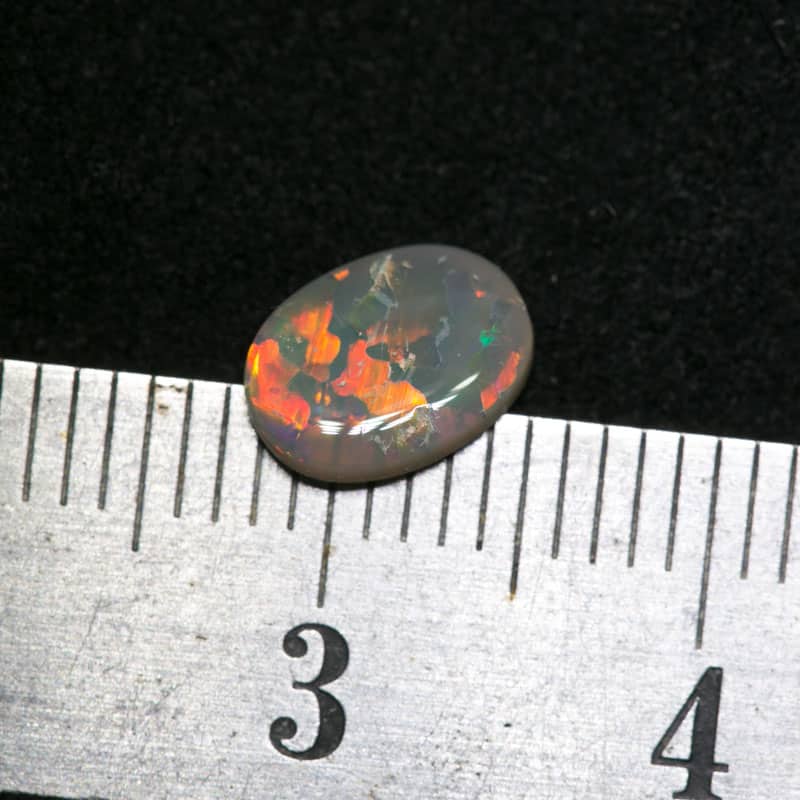 0.54 ct dark opal 7x6x1.5mm - Image 2