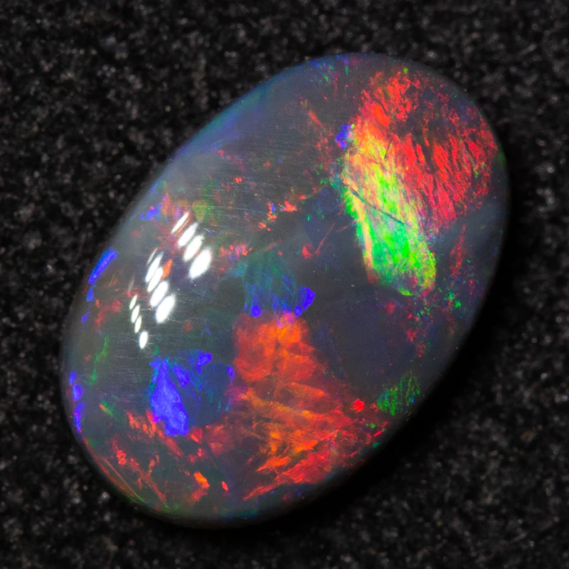 0.55 ct black opal 7.6x5.1x2.2mm - Image 2