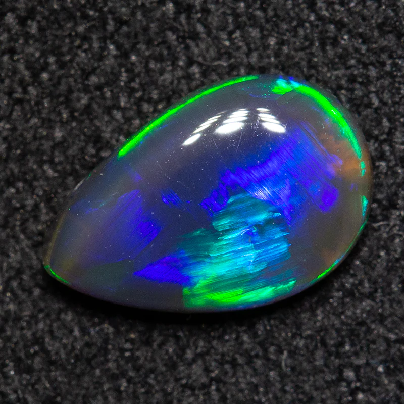 0.55 ct black opal 7.8x5.2x2.2mm - Image 2