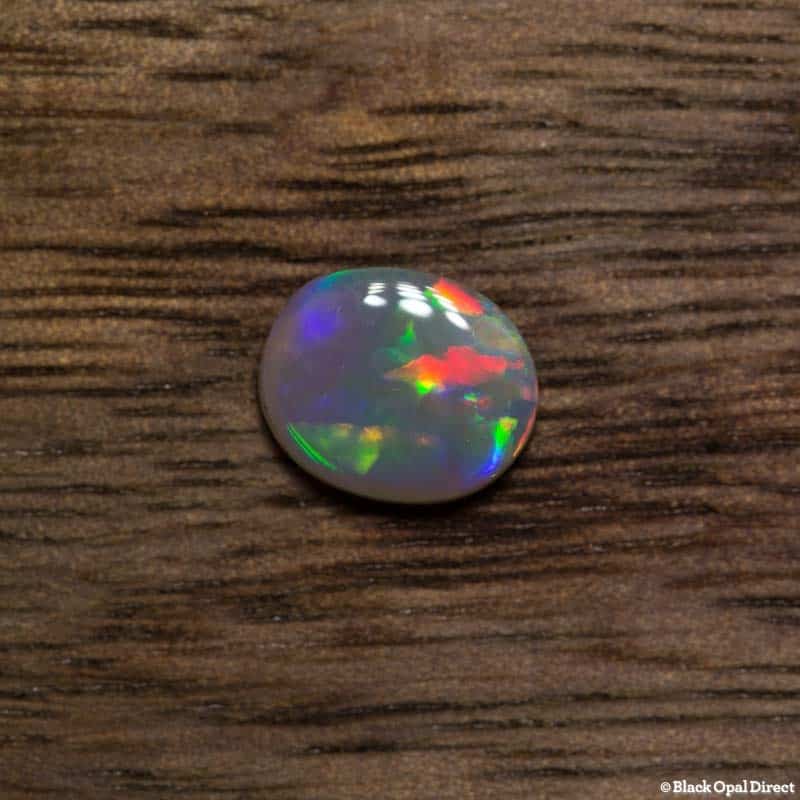 0.55 ct semi black opal 6.8x5.5x2mm - Image 2