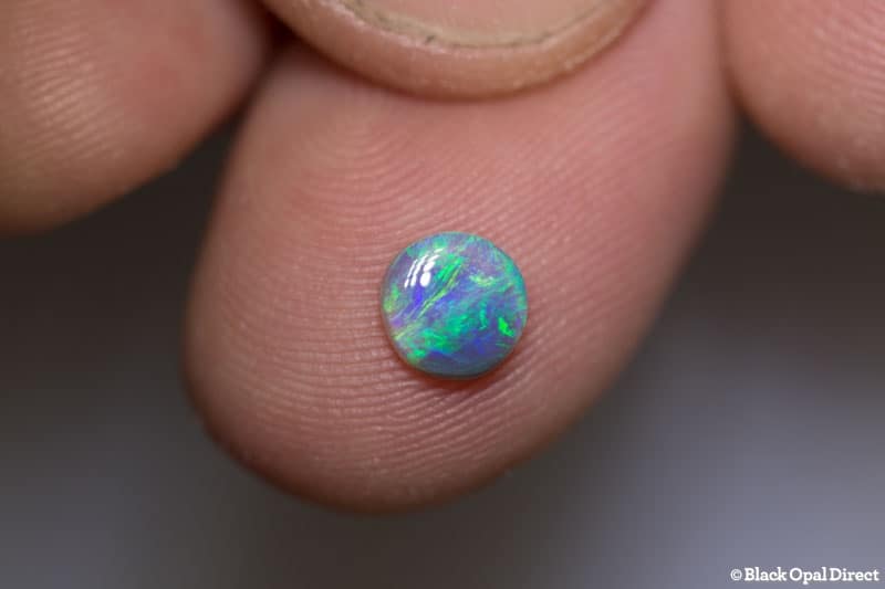 0.55 ct semi black opal 6mm round x 2mm thick - Image 2