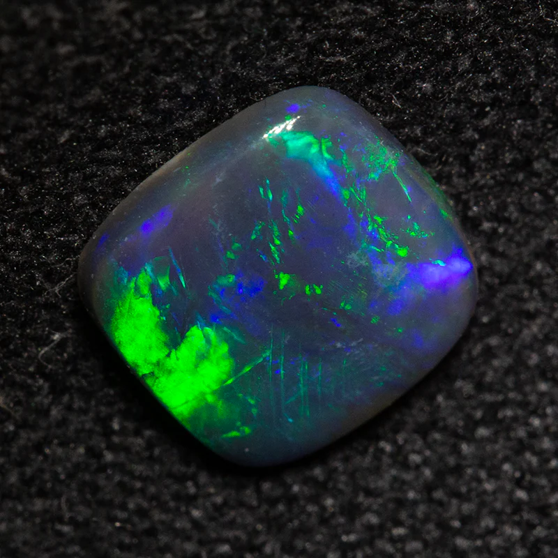 0.56 ct black opal 6.6x6.5x1.6mm - Image 2