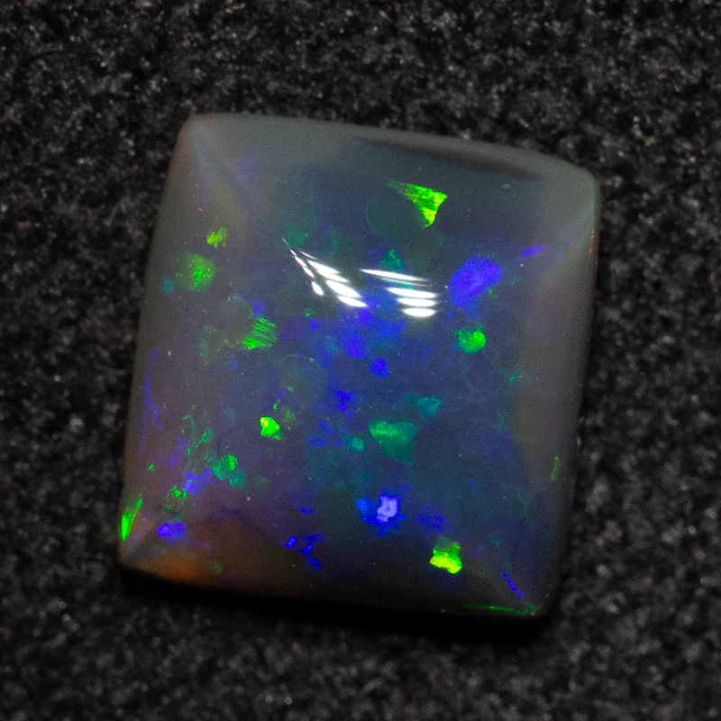 0.57 ct black opal 5.7x5.4x2.6mm - Image 3