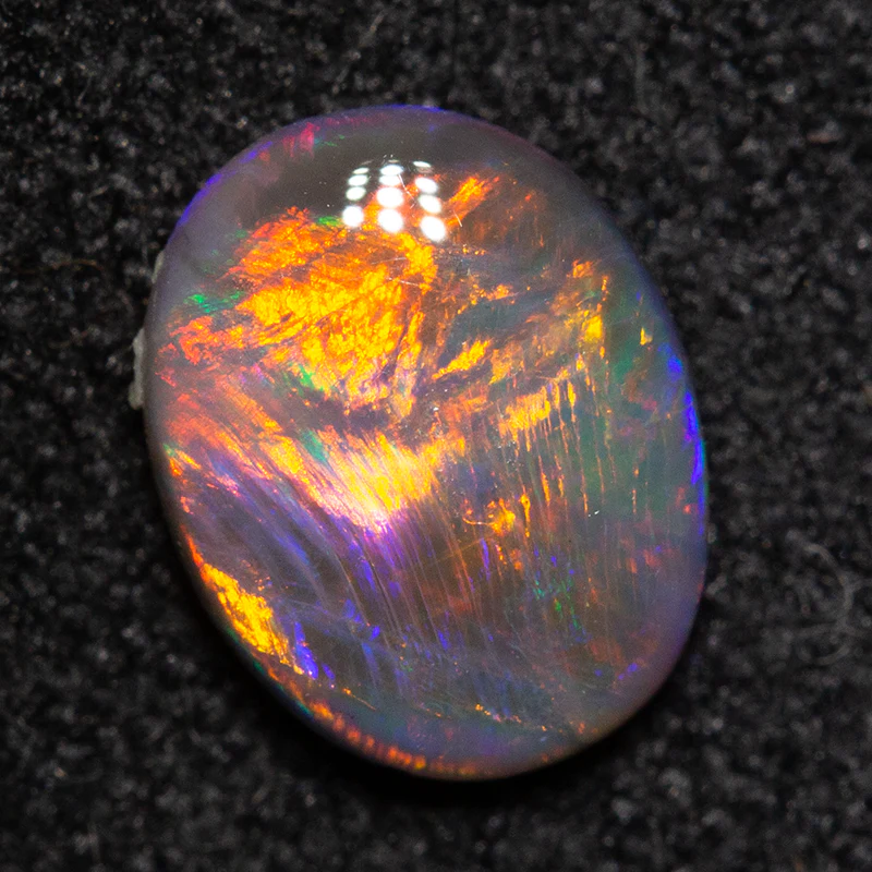 0.58 ct black opal 7.1x5.6x2.4mm - Image 2