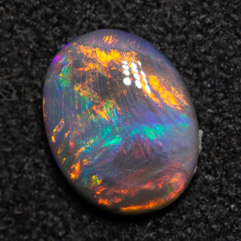 0.58 ct black opal 7.1x5.6x2.4mm - Image 3