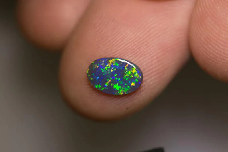0.58 ct black opal 9x6x1mm - Image 2