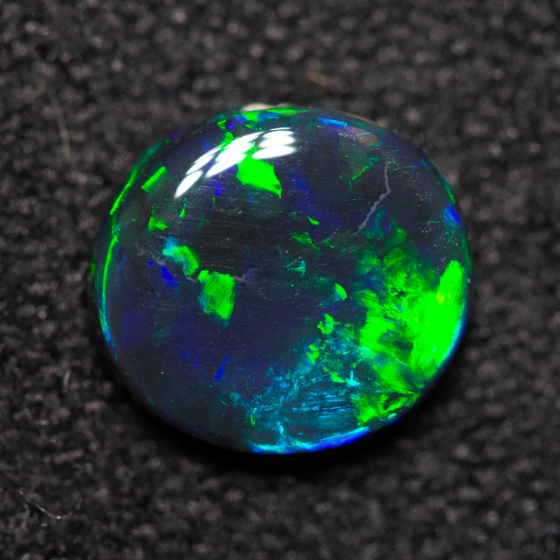 0.59 ct black opal 6.4x5.8x2.2mm - Image 3