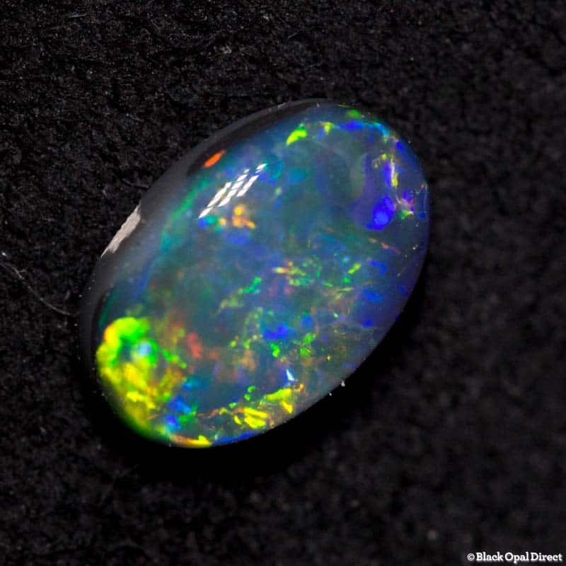 0.59 ct black opal 7x4.5x2mm - Image 2