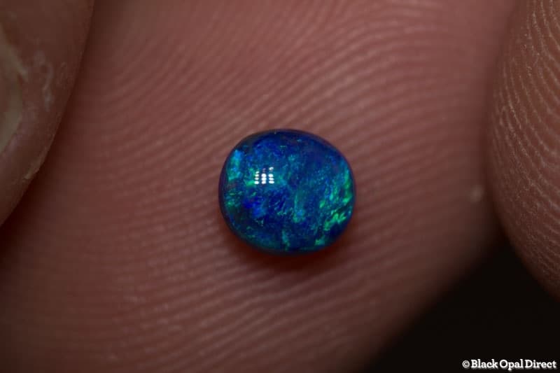 0.60 ct black opal 5.5x5x3mm - Image 2