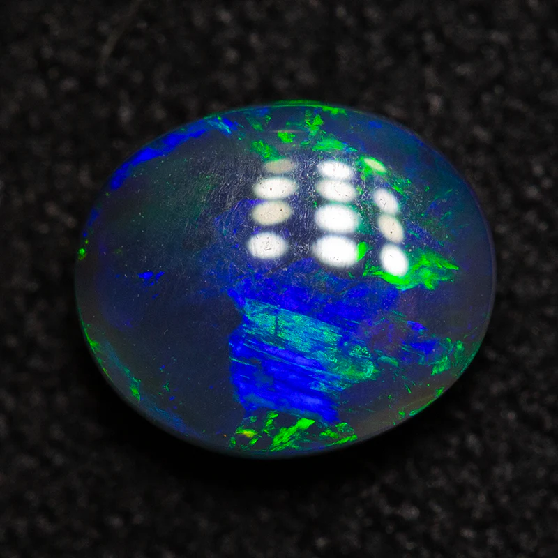 0.61 ct black opal 6.2x5.3x2.8mm - Image 3