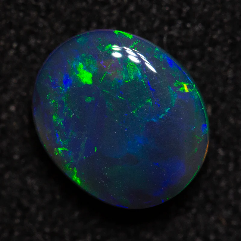 0.61 ct black opal 6.2x5.3x2.8mm - Image 4