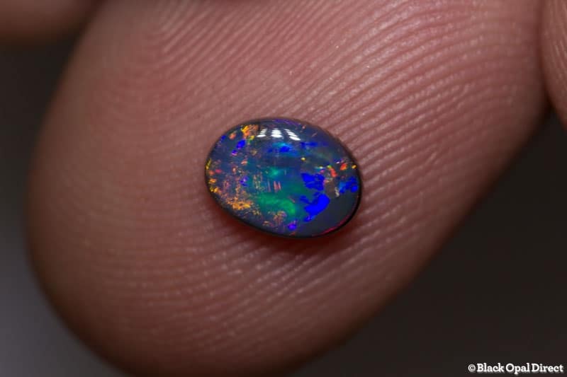 0.61 ct black opal gem 7x5x2.2mm - Image 2