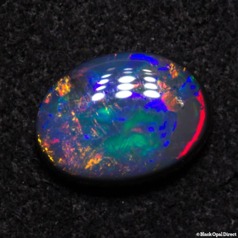 0.61 ct black opal gem 7x5x2.2mm - Image 4