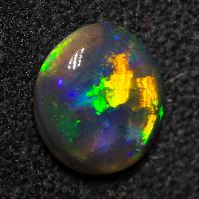 0.62 ct black opal 6.9x6.4x2.4mm - Image 2