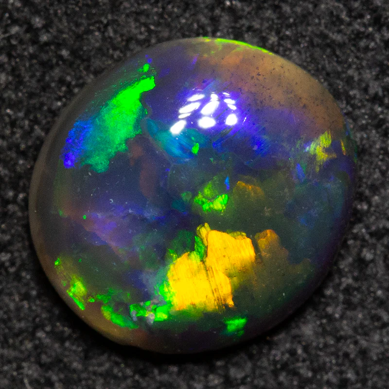 0.62 ct black opal 6.9x6.4x2.4mm - Image 3