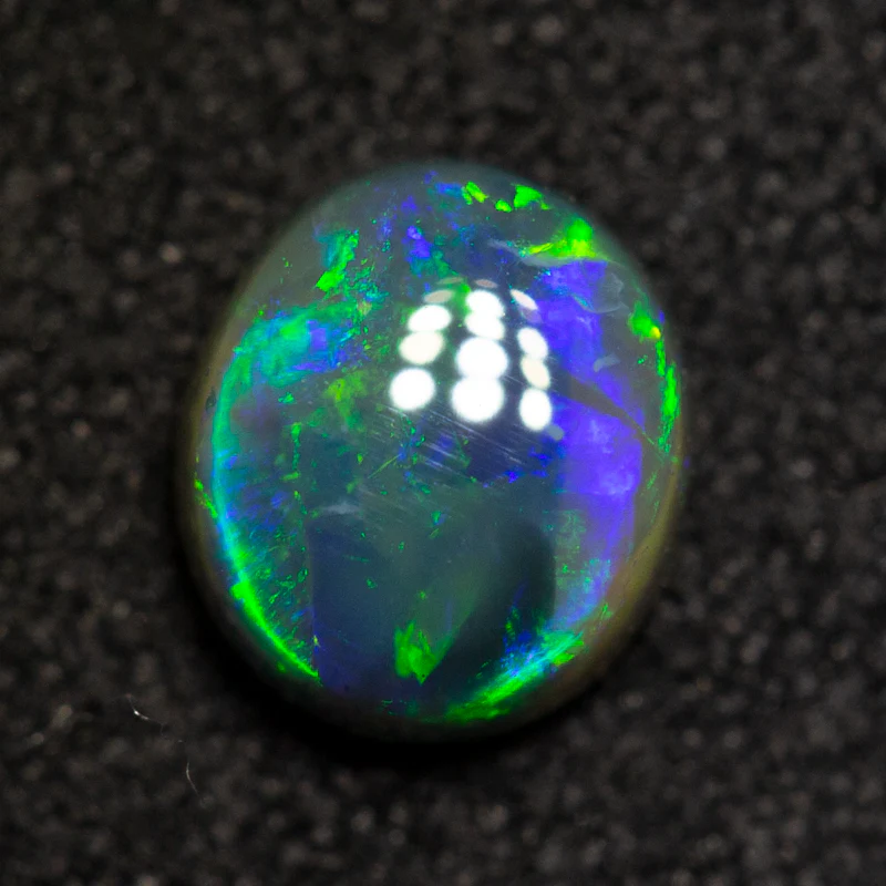 0.62 ct black opal 6x5.2x2.8mm - Image 2