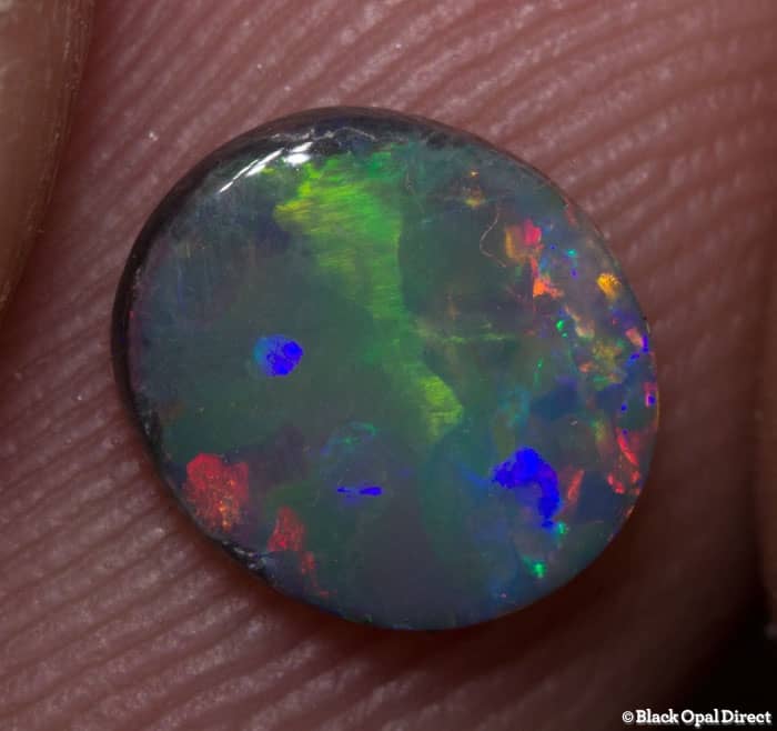 0.62 ct black opal 7.5x6.5x2mm - Image 2