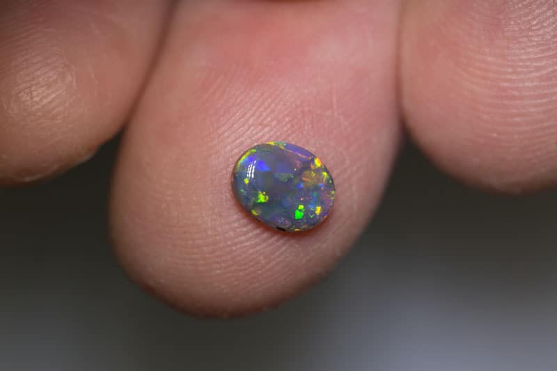 0.64 ct dark opal 7x5.5x2mm - Image 3