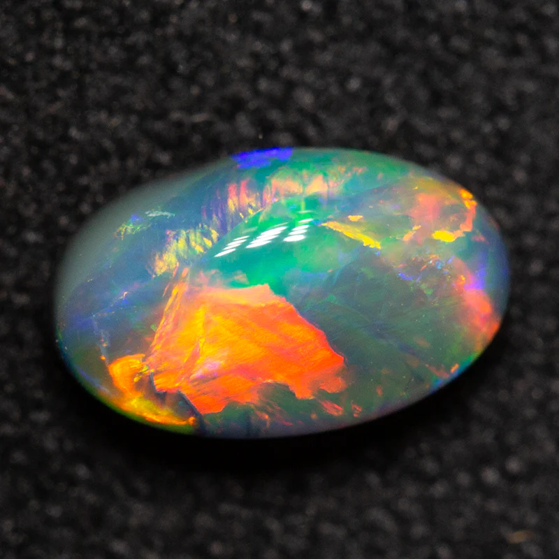 0.65 ct black opal 7.1x4.2x3.3mm - Image 2