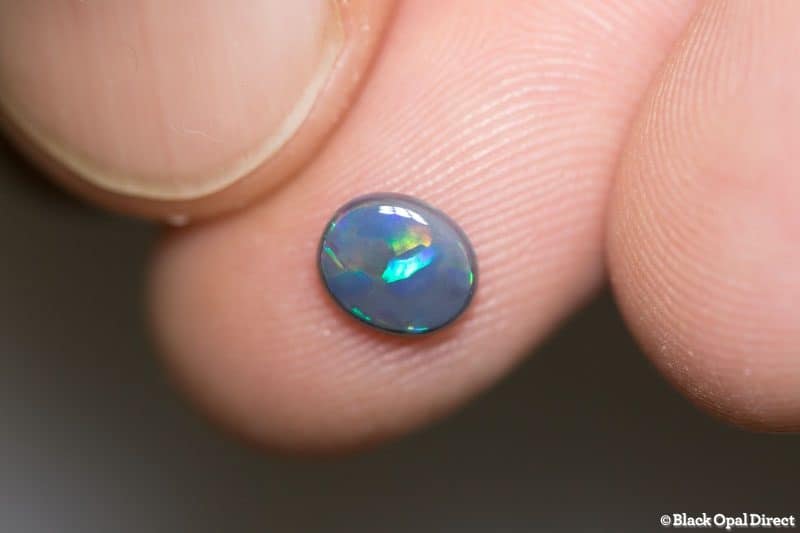 0.65 ct black opal 7x6x2mm - Image 2