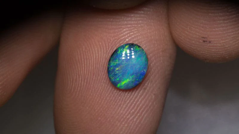 0.65 ct black opal 7x6x2mm - Image 2