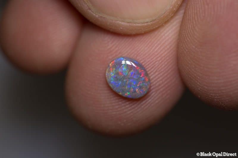 0.65 ct dark opal 7x5.5x2mm - Image 2