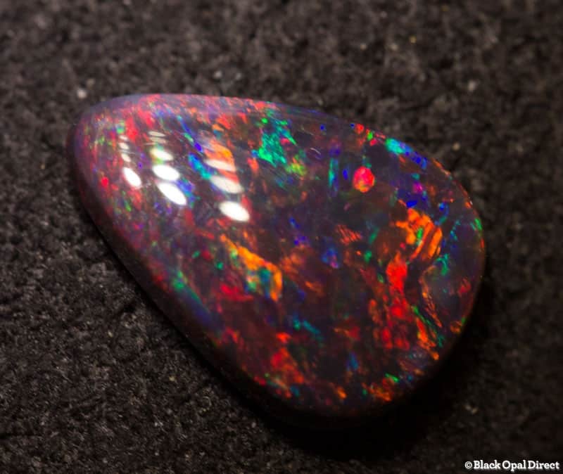 0.65 ct gem drop shaped black opal 9x6x2mm - Image 2