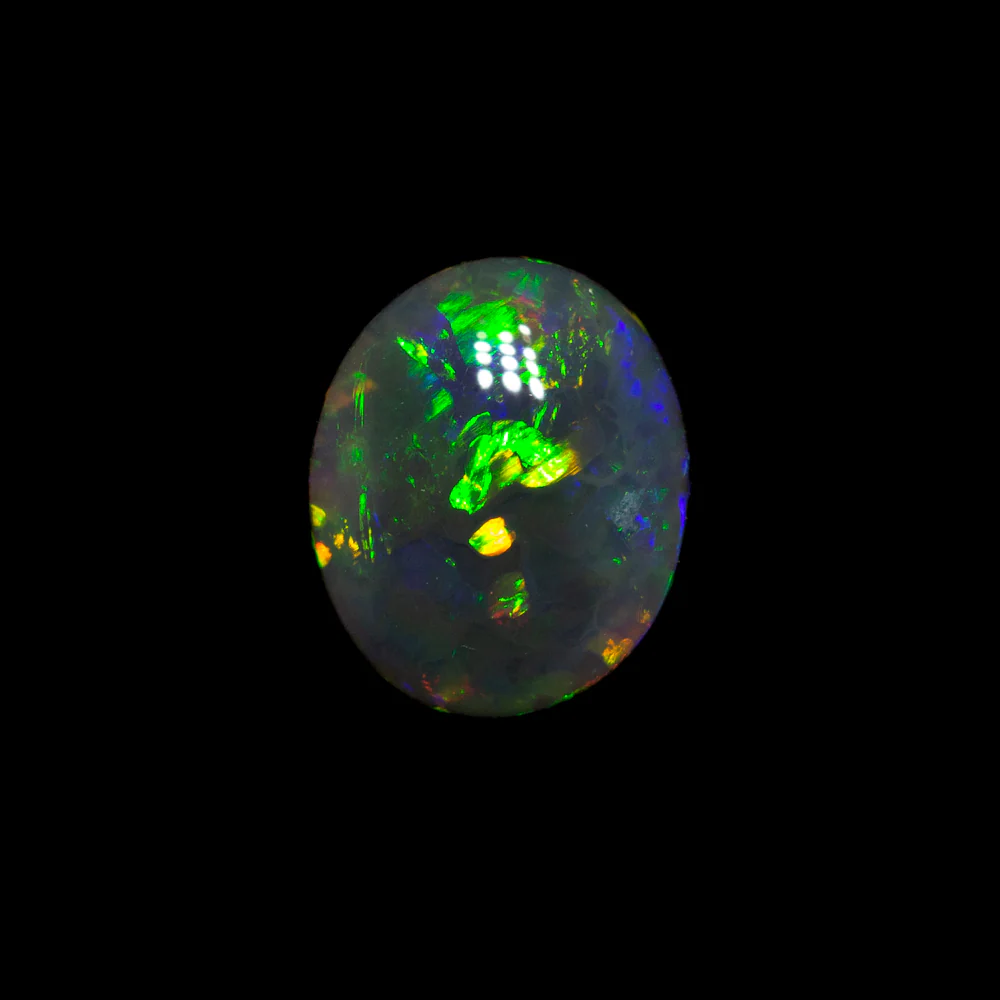 0.66 ct black opal 6.7x5.5x2.8mm - Image 2