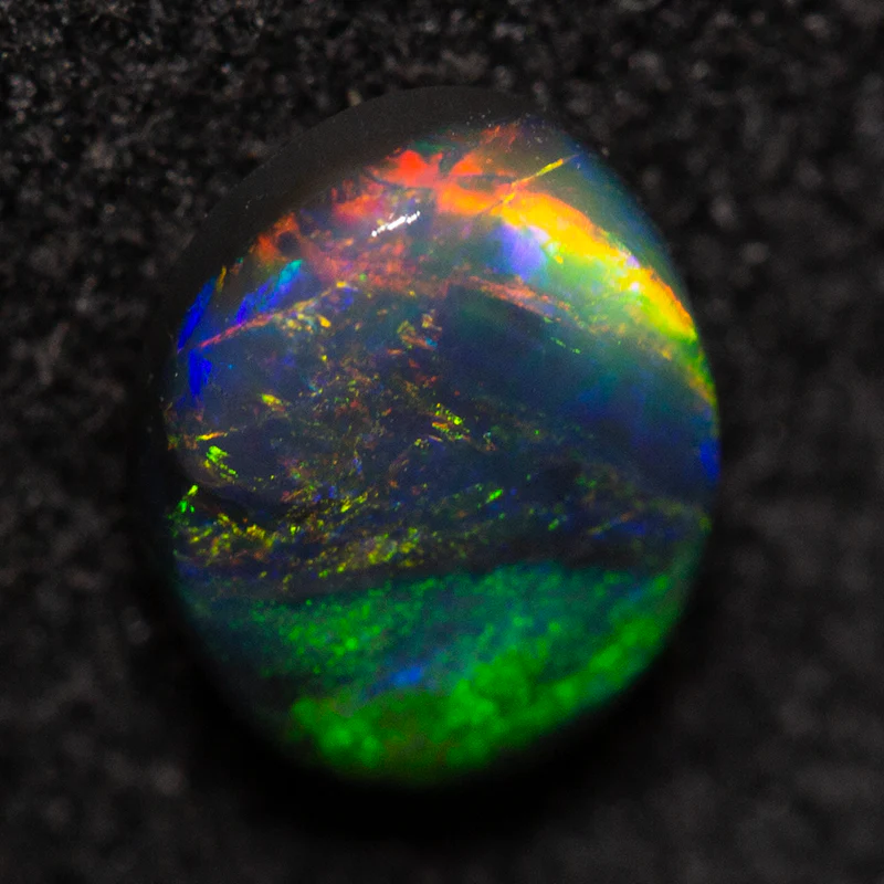 0.66 ct black opal 6.8x5.2x2.7mm - Image 3