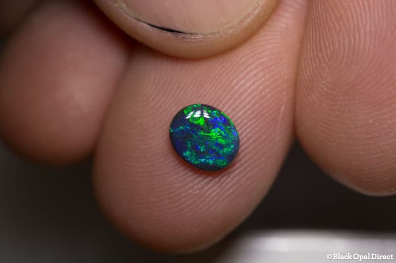 0.66 ct black opal 7x6x2mm - Image 2