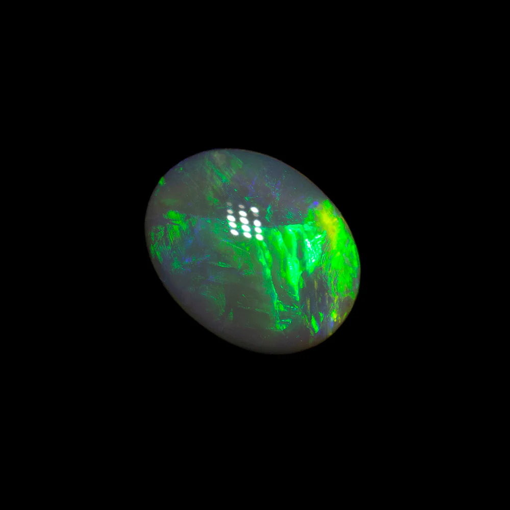 0.67 ct black opal 6.7x5.3x3mm - Image 2