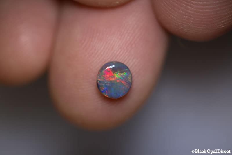 0.67 ct black opal 6mm round x 3mm - Image 2