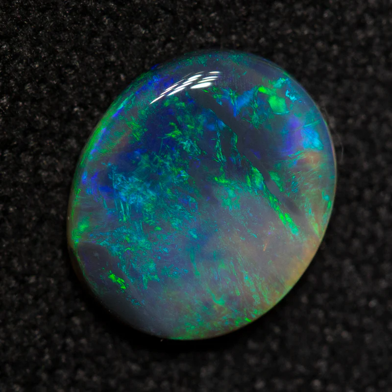 0.67 ct black opal 7.6x6.5x1.8mm - Image 2