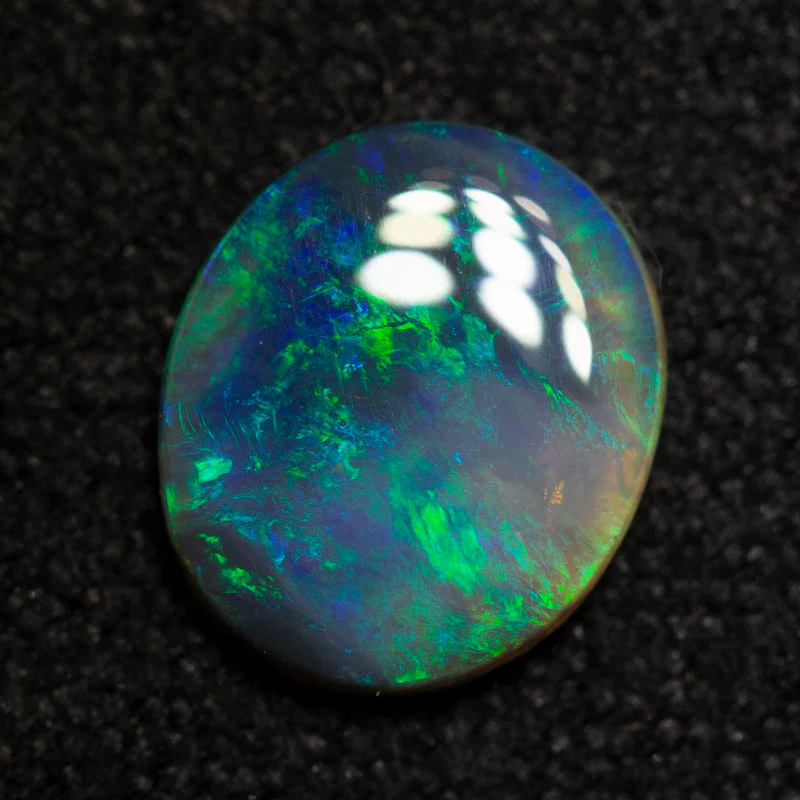 0.67 ct black opal 7.6x6.5x1.8mm - Image 3