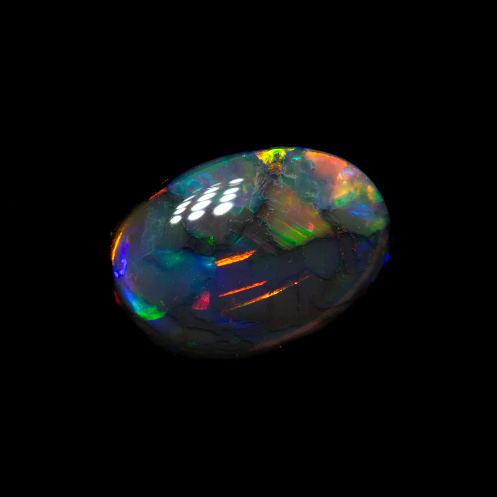 0.67 ct black opal 7.7x5.4x2.5mm - Image 2