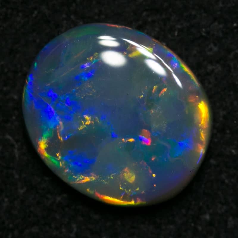 0.68 ct black opal 7x6x2mm - Image 2