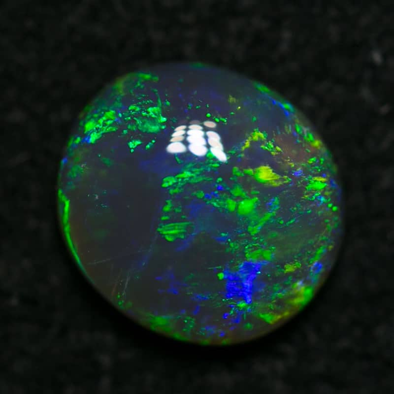 0.68 ct semi black opal 6.5x6x2mm - Image 3