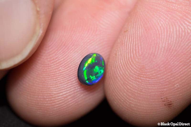 0.69 ct black opal 6.5x5x3mm - Image 2