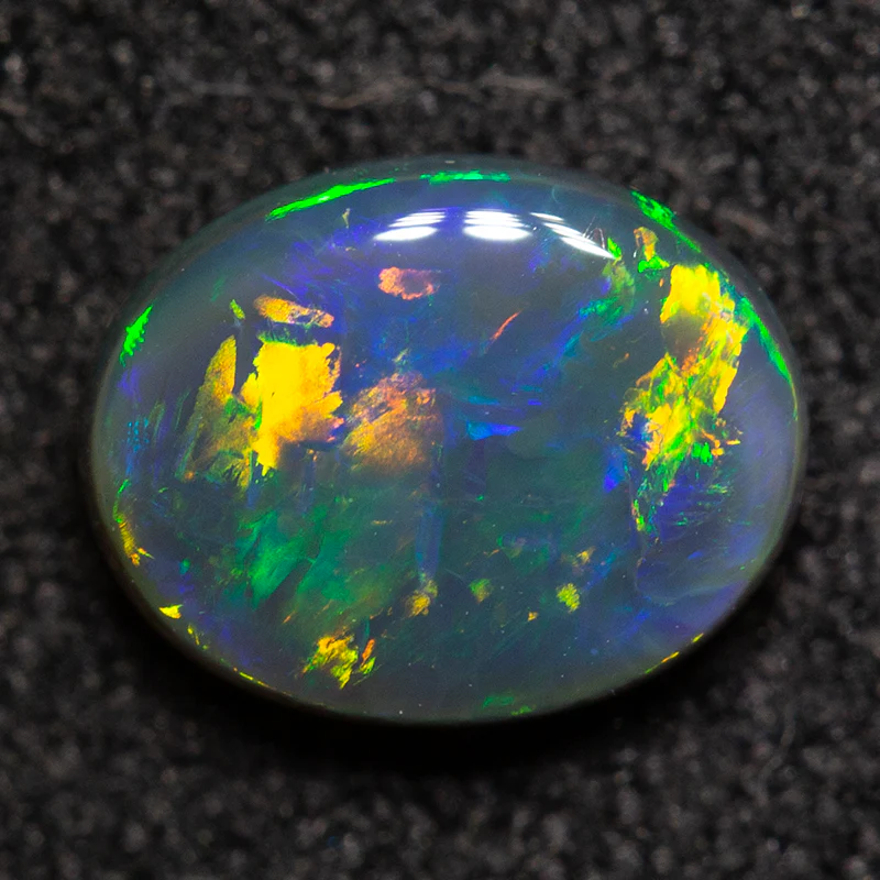0.70 ct black opal 6.9x5.4x2.7mm - Image 2