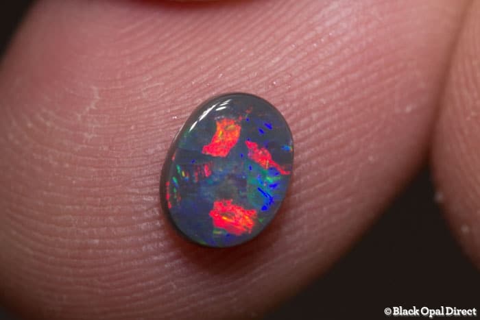 0.70 ct black opal gem 7x5.5x2mm - Image 2