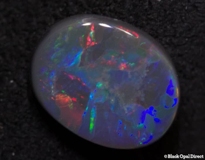 0.70 ct black opal gem 7x5.5x2mm - Image 3